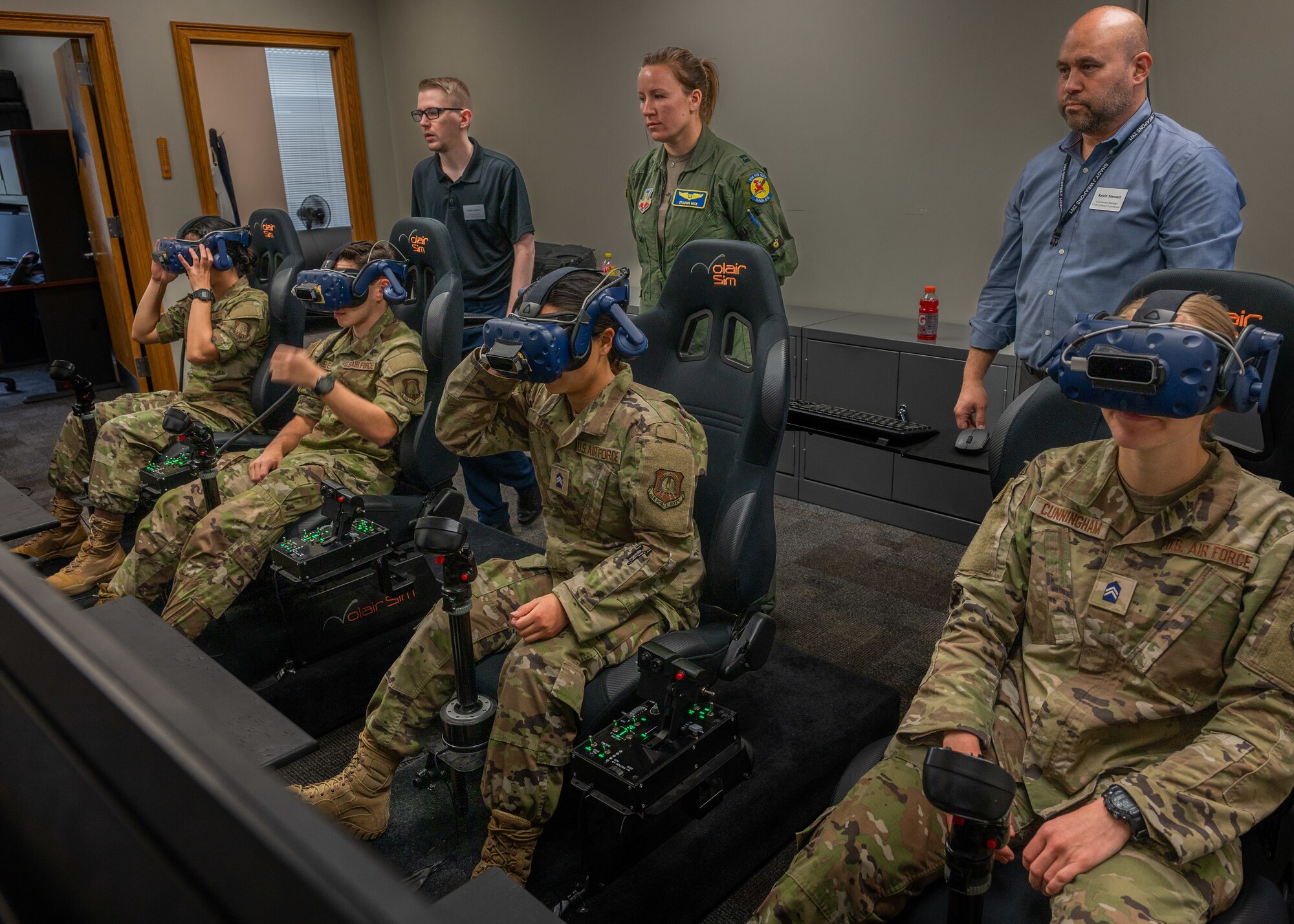 Air Force ROTC Academy Cadets prepare to learn how to fly F-15E Strike Eagles in a virtual reality training simulation at Seymour Johnson Air Force Base, North Carolina, August 3, 2023. This was part of a week-long tour aimed to enhance the cadets’ knowledge of Air Force career fields and a closer look at the base’s mission. (U.S. Air Force photo by Airman 1st Class Leighton Lucero)