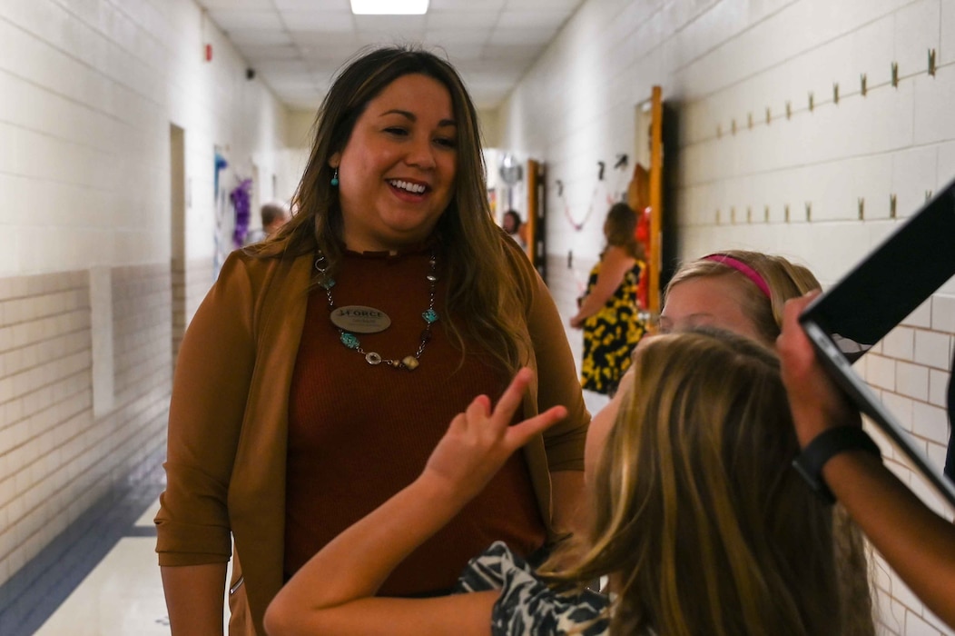 Gwendolyn Brakebill, 97th Force Support Squadron school liaison program manager, talks with students at L. Mendel Rivers Elementary School, Altus, Oklahoma, Aug. 7, 2023. Brakebill spent 13 years in education, teaching kindergarten and upper elementary school. (U.S. Air Force photo by Airman 1st Class Kari Degraffenreed)