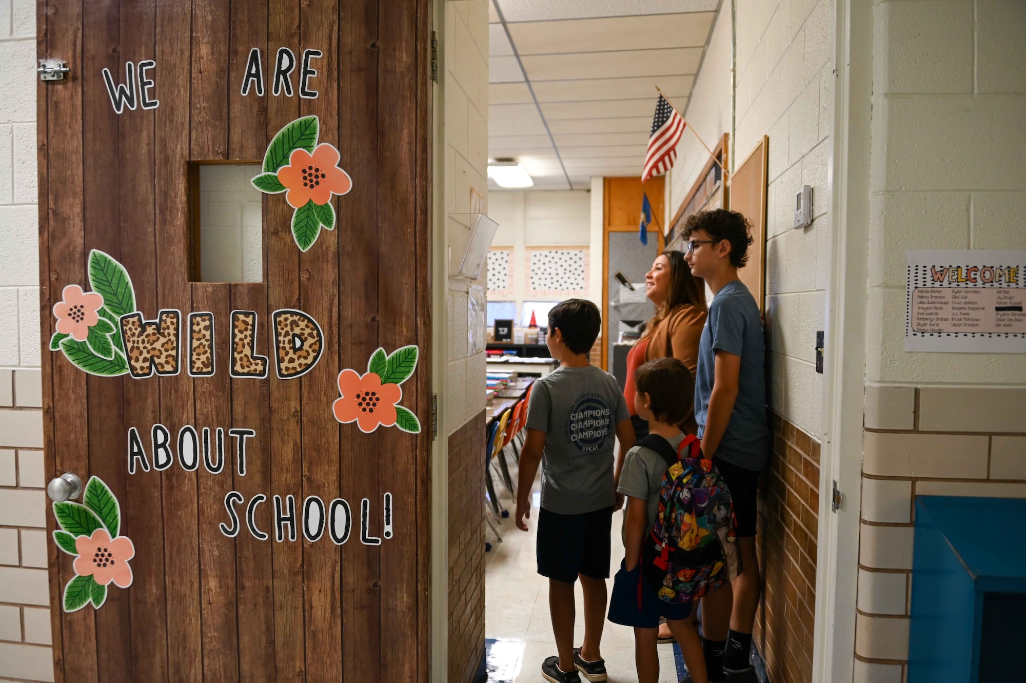 Gwendolyn Brakebill, 97th Force Support Squadron school liaison program manager, and her three sons visit her old classroom at L. Mendel Rivers Elementary School, Altus, Oklahoma, Aug. 7, 2023. Brakebill taught third grade at Rivers Elementary School for eight years. (U.S. Air Force photo by Airman 1st Class Kari Degraffenreed)
