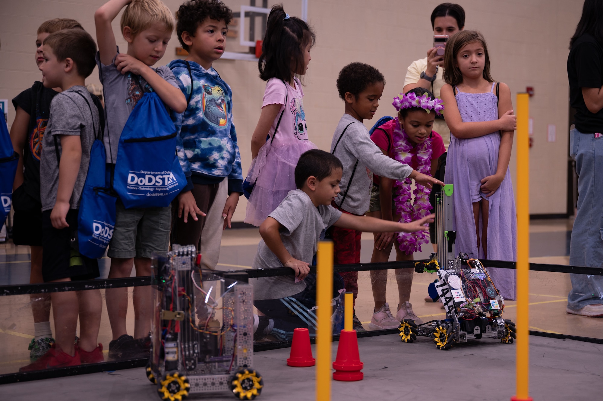 Students from the Wayne County community watch a robotics demonstration during Inspire 4th at Seymour Johnson Air Force Base, North Carolina, Aug. 4, 2023. Inspire 4th was part of Project Quesada which is an Air Combat Command initiative to identify opportunities to partner with Hispanic serving institutions and other minority serving institutions, as well as expose and inspire science, technology, engineering and math students to careers within ACC. (U.S. Air Force photo by Airman 1st Class Rebecca Sirimarco-Lang)