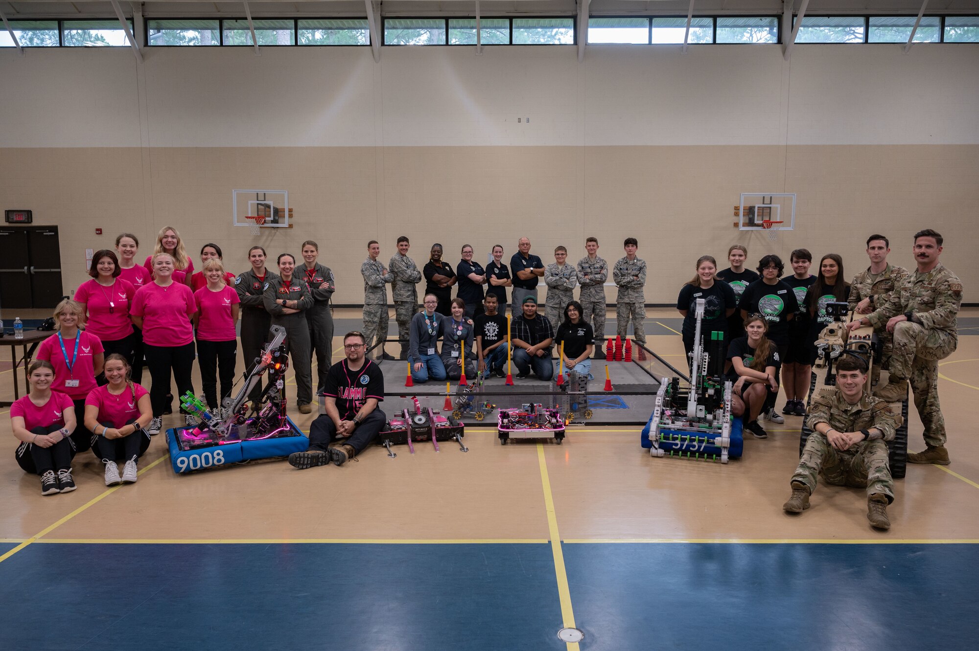 Students from the Wayne County community and members assigned to the 4th Fighter Wing pose for a photo during Inspire 4th at Seymour Johnson Air Force Base, North Carolina, Aug. 4, 2023. Inspire 4th was part of Project Quesada which is an Air Combat Command initiative to identify opportunities to partner with Hispanic serving institutions and other minority serving institutions, as well as expose and inspire science, technology, engineering and math students to careers within ACC. (U.S. Air Force photo by Airman 1st Class Rebecca Sirimarco-Lang)
