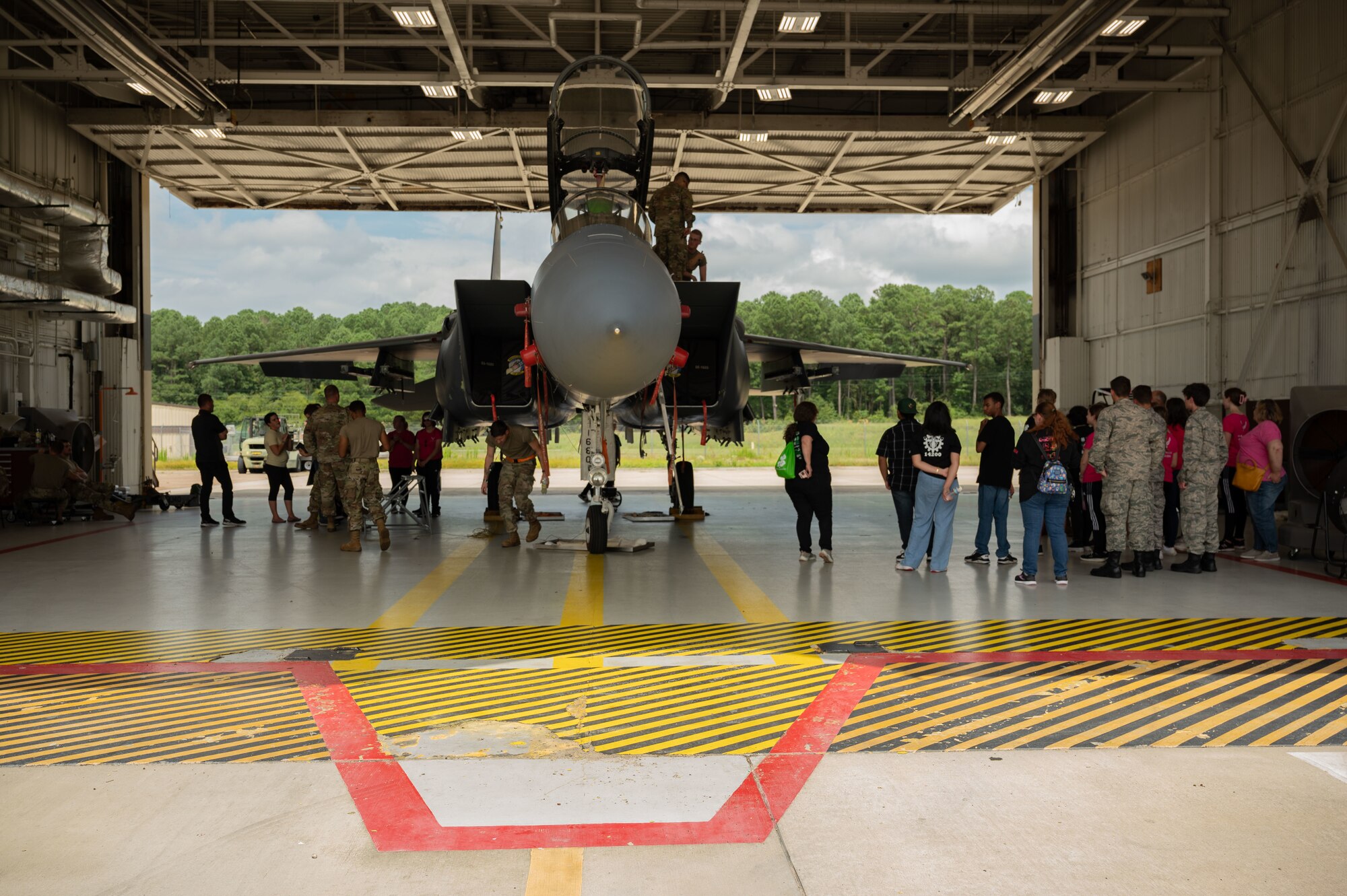 Students from the Wayne County community tour an F-15E Strike Eagle assigned to the 4th Fighter Wing during Inspire 4th at Seymour Johnson Air Force Base, North Carolina, Aug. 4, 2023. Inspire 4th was part of Project Quesada which is an Air Combat Command initiative to identify opportunities to partner with Hispanic serving institutions and other minority serving institutions, as well as expose and inspire science, technology, engineering and math students to careers within ACC. (U.S. Air Force photo by Airman 1st Class Rebecca Sirimarco-Lang)
