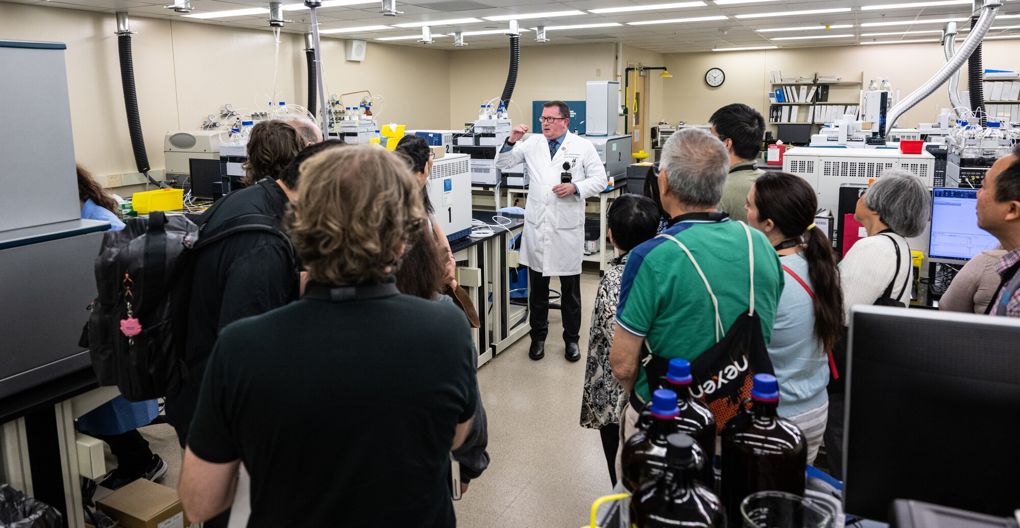 Jeff Walterscheid, Armed Forces Medical Examiner System chief toxicologist, briefs Massachusetts Institute of Technology alumni on the toxicology section during a tour on Dover Air Force Base, Delaware, Aug. 4, 2023. Members of the MIT Sloan Club of New York and MIT Club of New York were given the opportunity to visit AFMES, Air Force Mortuary Affairs Operations and the Bedrock Innovation Lab on Dover AFB. (U.S. Air Force photo by Staff Sgt. Marco A. Gomez)