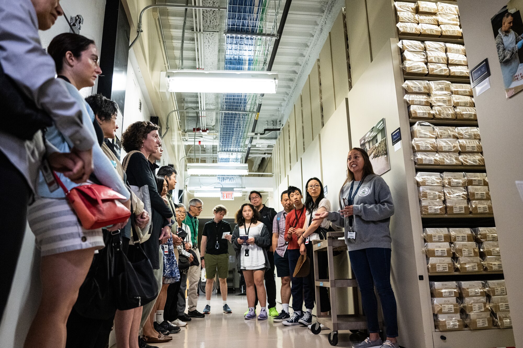 Mimi Kramer, right, Armed Forces Repository of Specimen Samples for the Identification of Remains supervisor, briefs Massachusetts Institute of Technology alumni on the AFRSSIR mission within the Armed Forces Medical Examiner System, during a tour on Dover Air Force Base, Delaware, Aug. 4, 2023. Members of the MIT Sloan Club of New York and MIT Club of New York were given the opportunity to visit AFMES, Air Force Mortuary Affairs Operations and the Bedrock Innovation Lab on Dover AFB. (U.S. Air Force photo by Staff Sgt. Marco A. Gomez)
