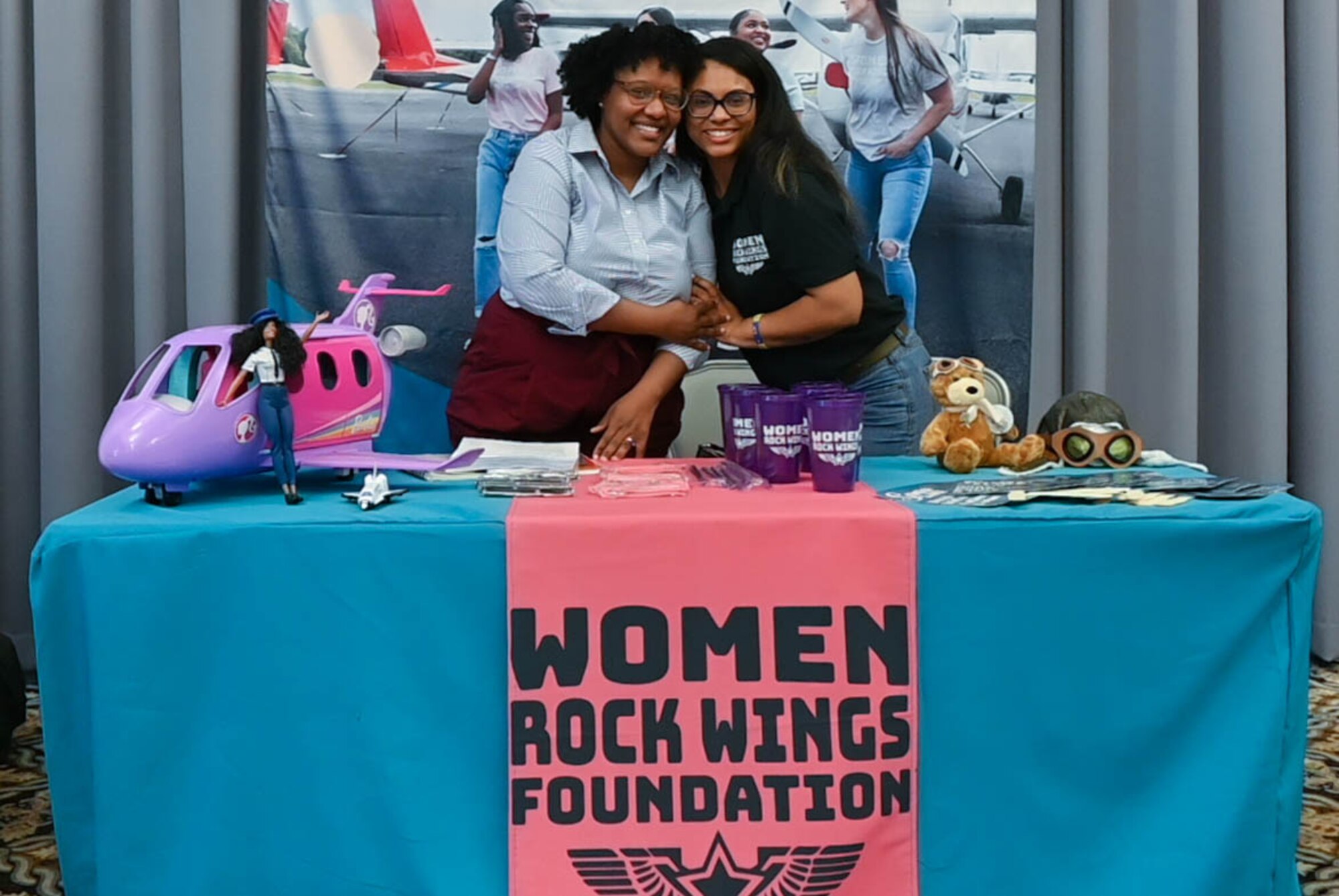 Capt. Meagan Hobson, left, 612th Airlift Wing chaplain, and Tech. Sgt. Brittany Nowell, right, 436th Airlift Wing noncommissioned officer in charge of occupational safety, pose for a photo during the Fly High Career-a-thon Fair on Dover Air Force Base, Delaware, Aug. 3, 2023. The event gave Airmen the opportunity to network with well-known aviation companies and learn about career opportunities in the industry.