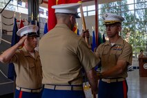 U.S. Marine Corps Col. Joel C. Schumacher, the outgoing 9th Marine Corps District commanding officer, passes the colors to Col. Aaron C. Lloyd, the oncoming commanding officer, during a change of command ceremony at Naval Station Great Lakes, July 18, 2023. The change of command ceremony serves as the official changeover between commanding officers, honoring the outgoing officer’s contributions to the unit while offering the opportunity for the oncoming officer to introduce himself to the Marines now under his charge. (U.S. Marine Corps photo by Lance Cpl. Reine Whitaker)