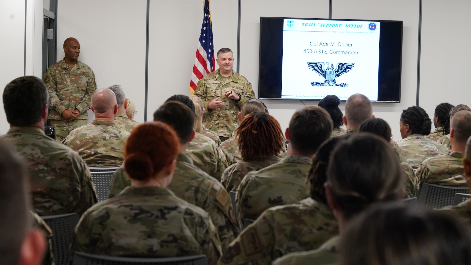 Command Chief stands in front of group of Airmen and introduces himself