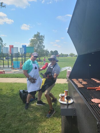 Photo shows volunteers with SSP’s Activity and Recreations Committee getting the grill ready at the SSP command picnic at Joint Base Anacostia-Bolling. The command picnic was organized by SSP’s Activity and Recreations Committee and offered personnel and their families an opportunity to boost camaraderie and participate in various outdoor activities. (U.S. Navy photo by Shelby Thompson/Released)