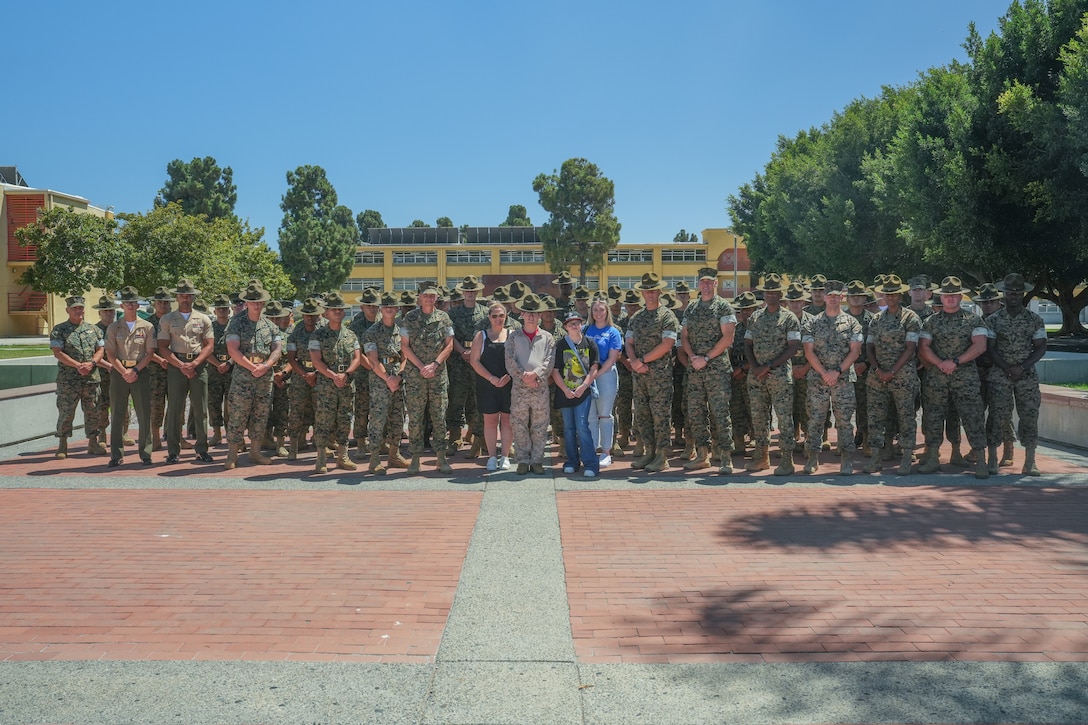 Cade Liles, a child with the Make-A-Wish foundation, poses for a group photo with personnel of Marine Corps Recruit Depot San Diego, Aug. 3, 2023. MCRD San Diego supported the mission of the Make-A-Wish foundation in granting Cade Liles’ wish of experiencing portions of Marine training and military life