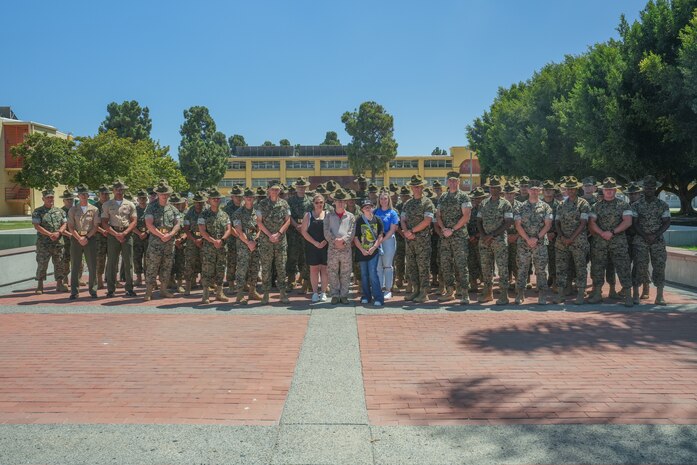Cade Liles, a child with the Make-A-Wish foundation, poses for a group photo with personnel of Marine Corps Recruit Depot San Diego, Aug. 3, 2023. MCRD San Diego supported the mission of the Make-A-Wish foundation in granting Cade Liles’ wish of experiencing portions of Marine training and military life