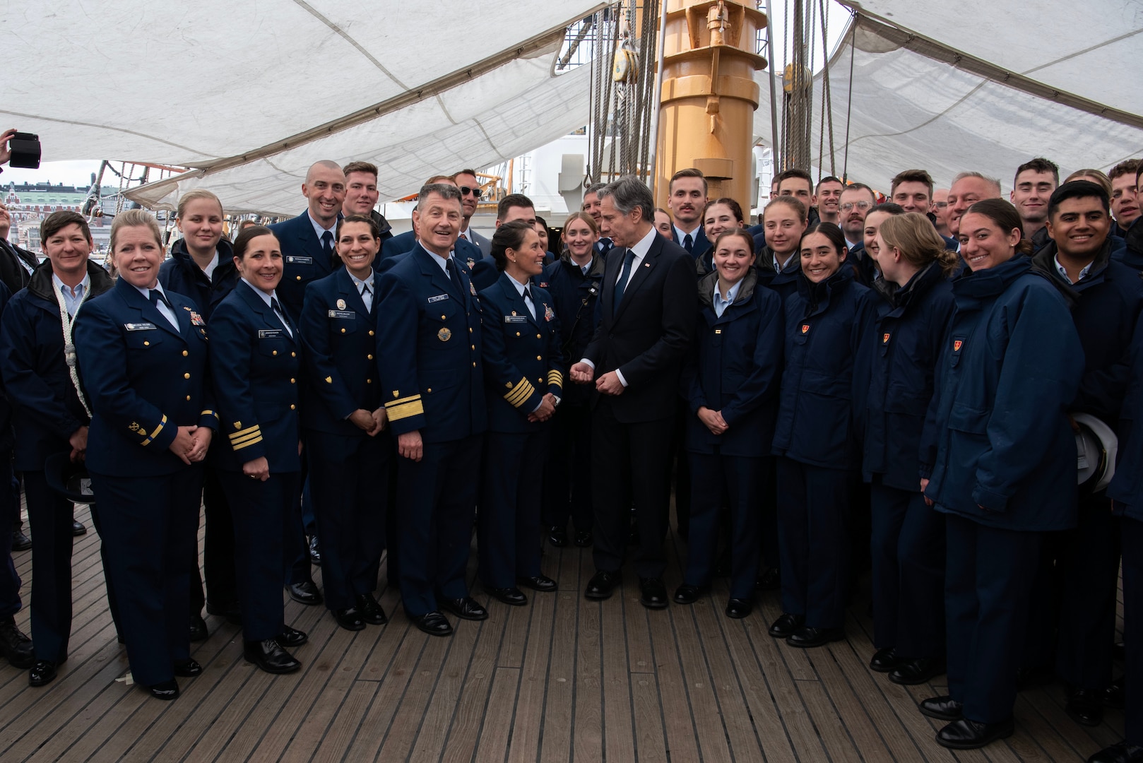 U.S. Secretary of State Antony Blinken, middle, takes a photo with the USCGC Eagle's (WIX) crew during a reception aboard the cutter, June 2, 2023, in Helsinki, Finland. Eagle is a tall ship used as a training platform for future Coast Guard Academy officers as well as a vessel utilized for establishing and maintaining domestic and international relationships. (U.S. Coast Guard photo by Petty Officer 3rd Class Carmen Caver)