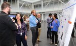 PhD, graduate and undergraduate students from SUNY Poly, RPI, University of Rochester, Siena College, and WPI, participate in a poster session as part of a 12 week internship program with AIM Photonics, in Albany, New York.