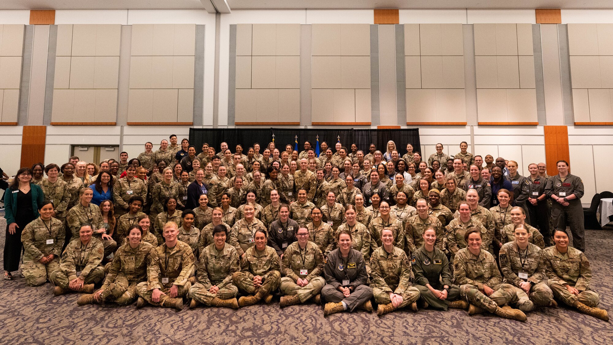 Attendees of the 2023 Air Force Global Strike Command Women's Leadership Symposium pose for a group photo in Shreveport, La., July 25, 2023. Airmen and Guardians from AFGSC bases participated in the symposium virtually or in-person, discussing the importance of equity in leadership at all levels, and getting to hear from speakers and panels about the successes achieved and challenges experienced by women in the military. (U.S. Air Force photo by Capt. Joshua Thompson)
