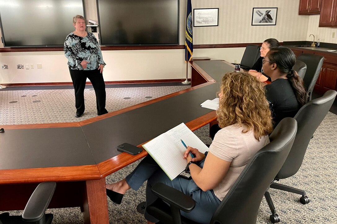 IMAGE: Naval Surface Warfare Center Dahlgren Division (NSWCDD) Dam Neck Activity's (DNA) Integrated Training Systems Division Head Mary Kay Anderson leads a small group discussion during a mentorship event, Aug. 1. The flash mentoring event titled, "So you want to be a senior leader," provided employees the opportunity to learn and speak with senior-level staff about their experiences and insight that helped them rise to their career milestones.