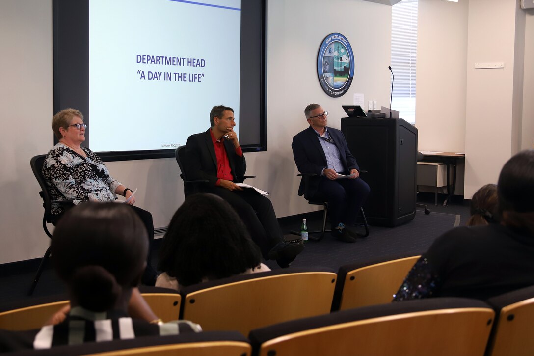 IMAGE: (from left to right) Naval Surface Warfare Center Dahlgren Division (NSWCDD) Dam Neck Activity's (DNA) Integrated Training Systems Division Head Mary Kay Anderson, Director David Richardson, and Deputy Director Dennis Cochran, participate in a discussion panel during a mentorship event, Aug. 1. The flash mentoring event titled, "So you want to be a senior leader," provided employees the opportunity to learn and speak with senior-level staff about their experiences and insight that helped them rise to their career milestones.