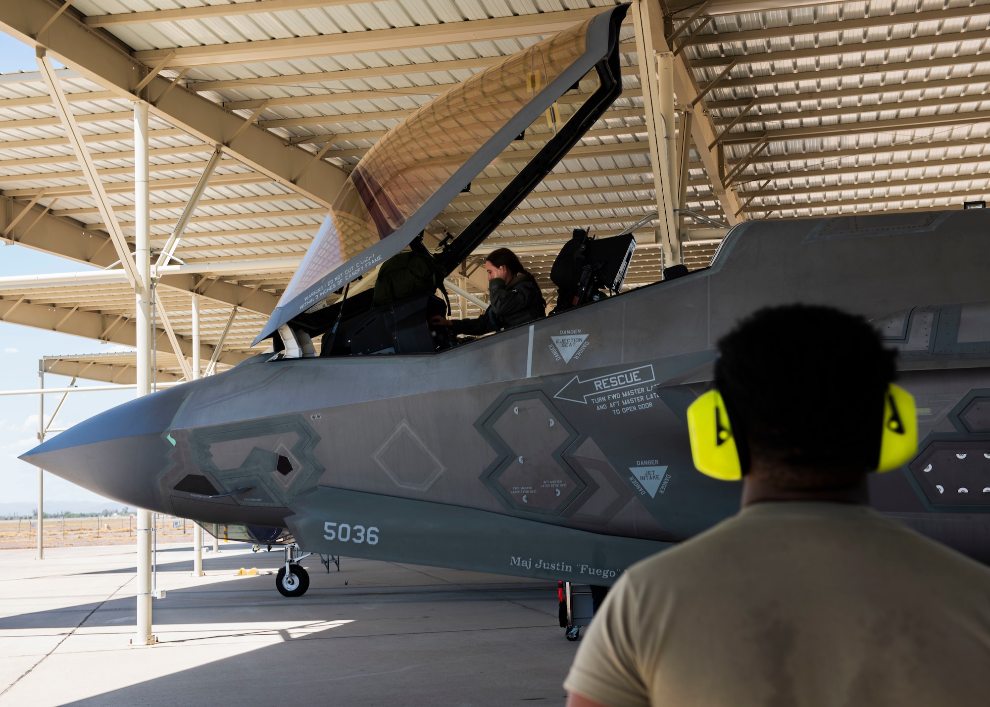U.S. Air Force Capt. Audrey Wilson, 56th Training Squadron student pilot, and Staff Sgt. Brian Chavis, 56th Aircraft Maintenance Squadron crew chief, prepare a U.S. Air Force F-35 Lightning II for takeoff Aug. 3, 2023, at Luke Air Force Base, Arizona.