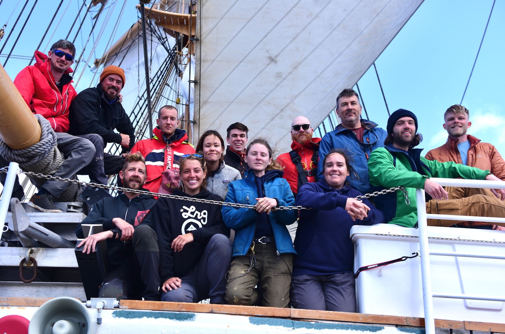 Mariners affiliated with sailing organization Tall Ships America pose for a group photo aboard USCGC Eagle (WIX 327), April 20, 2023, while underway in the Atlantic Ocean; pictured left to right, back row: Darrin Jackson, Ian Beaumont, Jeremy Lawrence, Amanda Weischedel, Kyle May, Andrew Orrison, Geoff Selhorst, James Fitzpatrick, Galen Kane; front row: Matt Thomas, Kaleena Davis, Madison Pulley, and Abby Werner. Eagle conducted a four-month summer deployment, sailing across the Atlantic Ocean, to teach practical seamanship skills to the future leaders of the U.S. Coast Guard, National Oceanic and Atmospheric Administration Corps, foreign military personnel as well as to exchange best practices with Tall Ships America. (U.S. Coast Guard photo by Petty Officer 2nd Class Brandon Hillard)
