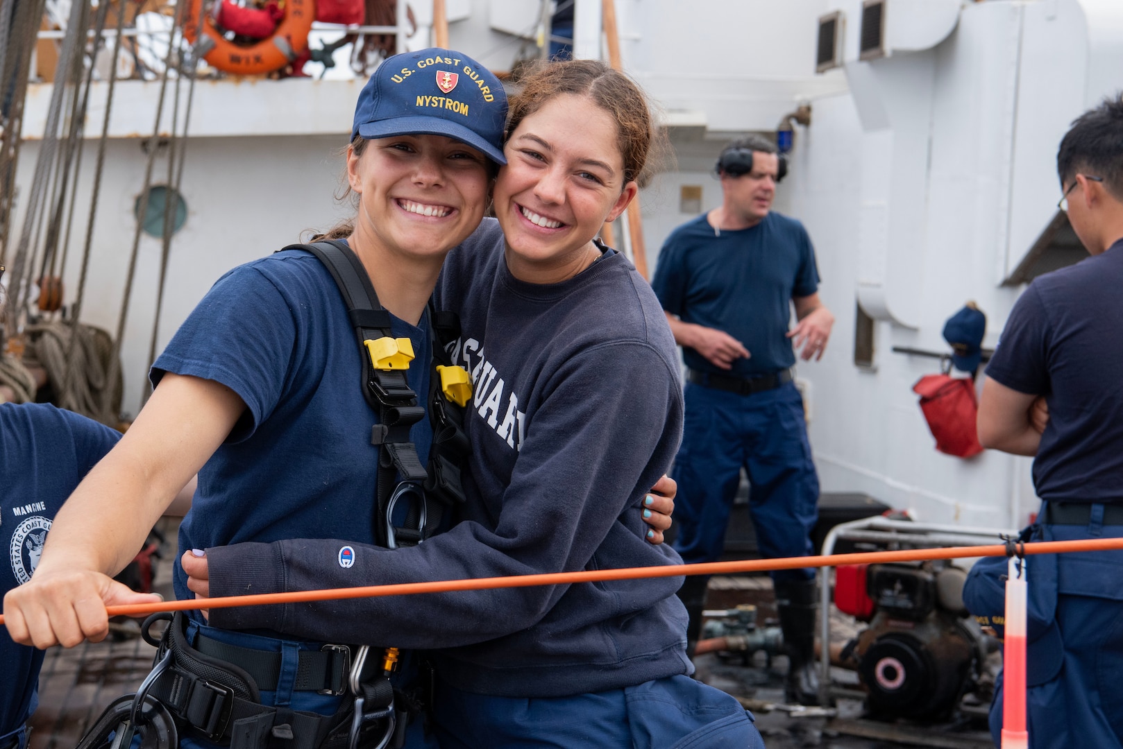 Coast Guard Academy Cadets Allison Nystrom and Laila Baameaur smile after completing a damage control exercise held on board USCGC Eagle (WIX 327), June 29, 2023, while underway in the Atlantic Ocean. Eagle, originally operated by the pre-World War II German navy and later taken as a war reparation by the United States, is now a training ship where U.S. Coast Guard cadets and officer candidates learn leadership and practical seamanship skills. (U.S. Coast Guard photo by Petty Officer 3rd Class Carmen Caver)