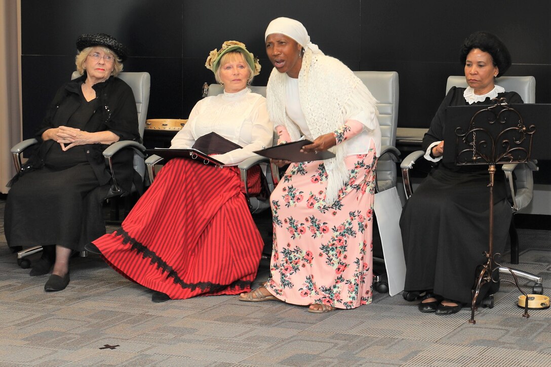 The “Suffragettes”, historical advocates for women’s rights, from right, Rebecca Marks Jimerson portrayed both Mary Church Terrell and Ida B. Wells, Dr. Rose Caballero, Galveston District Equal Employment Opportunity officer, as Sojourner Truth, Marcy Hanson as Elizabeth Cady Stanton and Marilyn Harris as Susan B. Anthony, shared the story of the Seneca Falls Convention of 1848, the first convention to promote women’s right to vote, and the decades of protesting it took to pass the 19th Amendment.