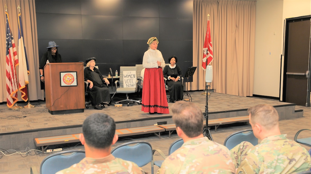 The “Suffragettes”, historical advocates for women’s rights, from right, Rebecca Marks Jimerson portrayed both Mary Church Terrell and Ida B. Wells, Dr. Rose Caballero, Galveston District Equal Employment Opportunity officer, as Sojourner Truth, Marcy Hanson as Elizabeth Cady Stanton and Marilyn Harris as Susan B. Anthony, shared the story of the Seneca Falls Convention of 1848, the first convention to promote women’s right to vote, and the decades of protesting it took to pass the 19th Amendment.