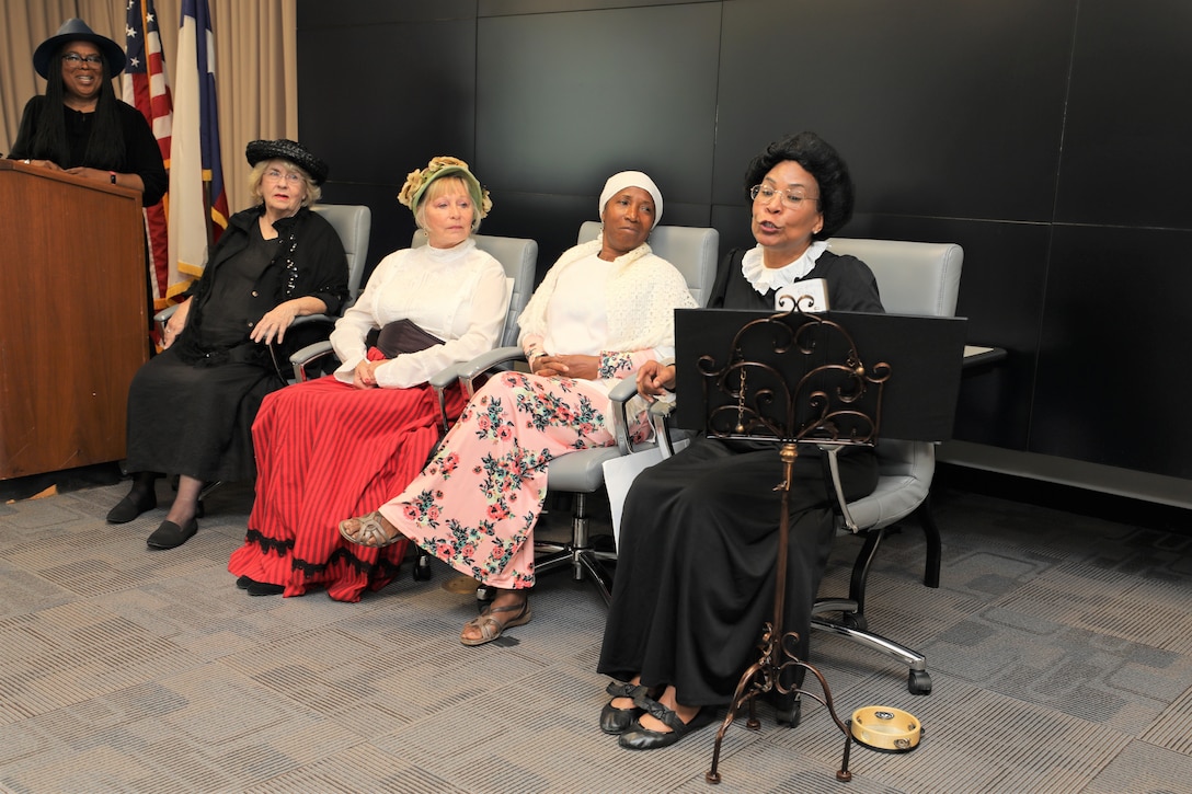 The “Suffragettes”, historical advocates for women’s rights, from right, Rebecca Marks Jimerson portrayed both Mary Church Terrell and Ida B. Wells, Dr. Rose Caballero, Galveston District Equal Employment Opportunity officer, as Sojourner Truth, Marcy Hanson as Elizabeth Cady Stanton and Marilyn Harris as Susan B. Anthony, shared the story of the Seneca Falls Convention of 1848, the first convention to promote women’s right to vote, and the decades of protesting it took to pass the 19th Amendment.