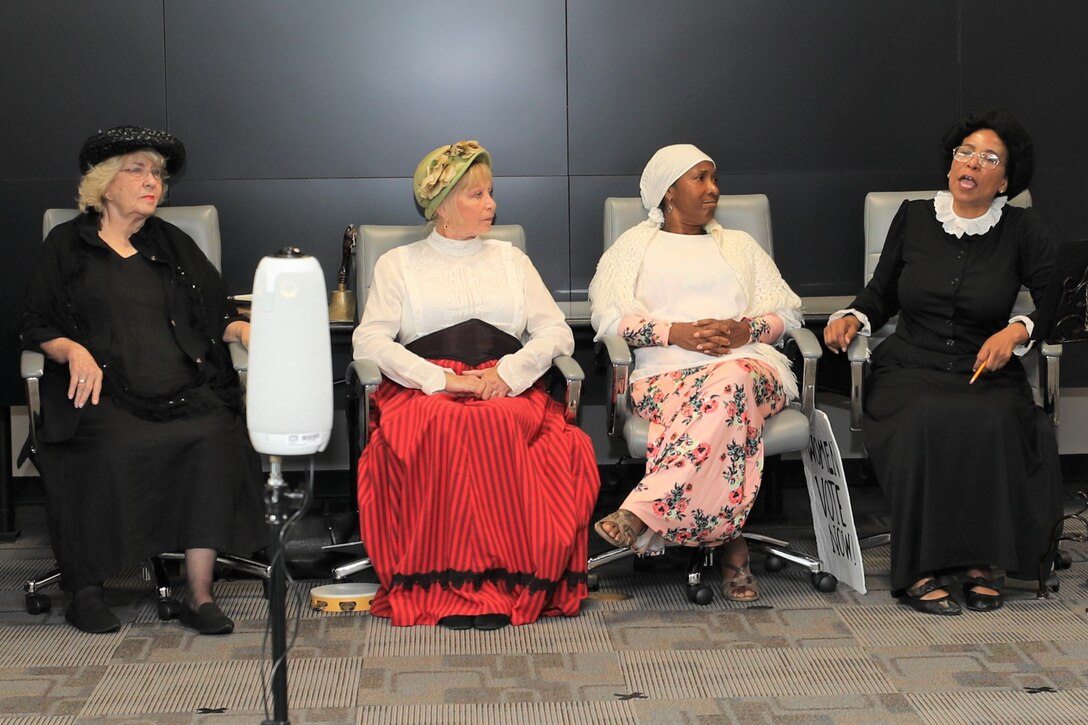 The “Suffragettes”, historical advocates for women’s rights, from right, Rebecca Marks Jimerson portrayed both Mary Church Terrell and Ida B. Wells, Dr. Rose Caballero, Galveston District Equal Employment Opportunity officer, as Sojourner Truth, Marcy Hanson as Elizabeth Cady Stanton and Marilyn Harris as Susan B. Anthony, shared the story of the Seneca Falls Convention of 1848, the first convention to promote women’s right to vote, and the decades of protesting it took to pass the 19th Amendment.