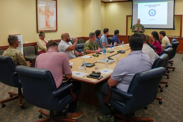 Joint Task Force-Red Hill (JTF-RH) Commander, U.S. Navy Vice Adm. John Wade meets with Senate Appropriations Committee staff delegates at JTF-RH Headquarters, Ford Island, Honolulu, Hawaii, Aug. 8, 2023. JTF-RH is in phase three of its five-phase defueling plan. Personnel are focused on completing quality control tasks, training, response preparation, the National Environmental Policy Act Environmental Assessment, regulatory approvals and operational planning for all future major milestones. This extensive preparatory work will help ensure the safe and expeditious defueling of the Red Hill Bulk Fuel Storage Facility. (DoD photo by U.S. Air National Guard Tech. Sgt. Nicholas Brown)