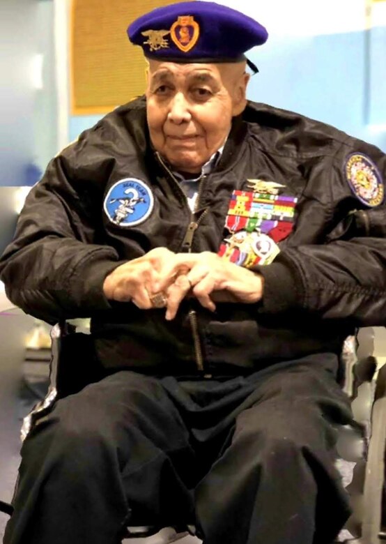 Retired U.S. Navy Chief Warrant Officer 4 Solomon Atkinson quietly waits in his wheelchair wearing his SEAL insignia, an eagle perched on a horizontal three-pronged trident, clutching a pistol, with an upright anchor, on his purple beret and decade’s worth of ribbons adorning his jacket before receiving the Alaska Governor’s Veteran Advocacy Award during a ceremony in Metlakatla, Alaska, Dec. 10, 2018.