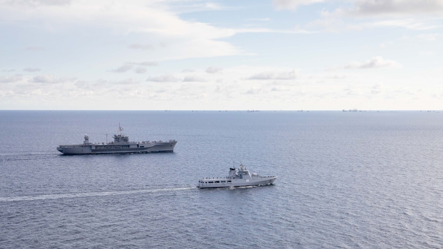 SOUTH CHINA SEA – (Aug. 5, 2023) U.S. 7th Fleet flagship USS Blue Ridge (LCC 19) conducts a passing exercise with Darussalam-class off shore patrol vessel KDB Darussalam (06), Aug. 5. Blue Ridge is the oldest operational ship in the Navy and as U.S. 7th Fleet command ship, routinely interacts and operates with allies and partners in preserving a free and open Indo-Pacific region. (U.S. Navy photo by Mass Communication Specialist 2nd Class Ryan M. Breeden)