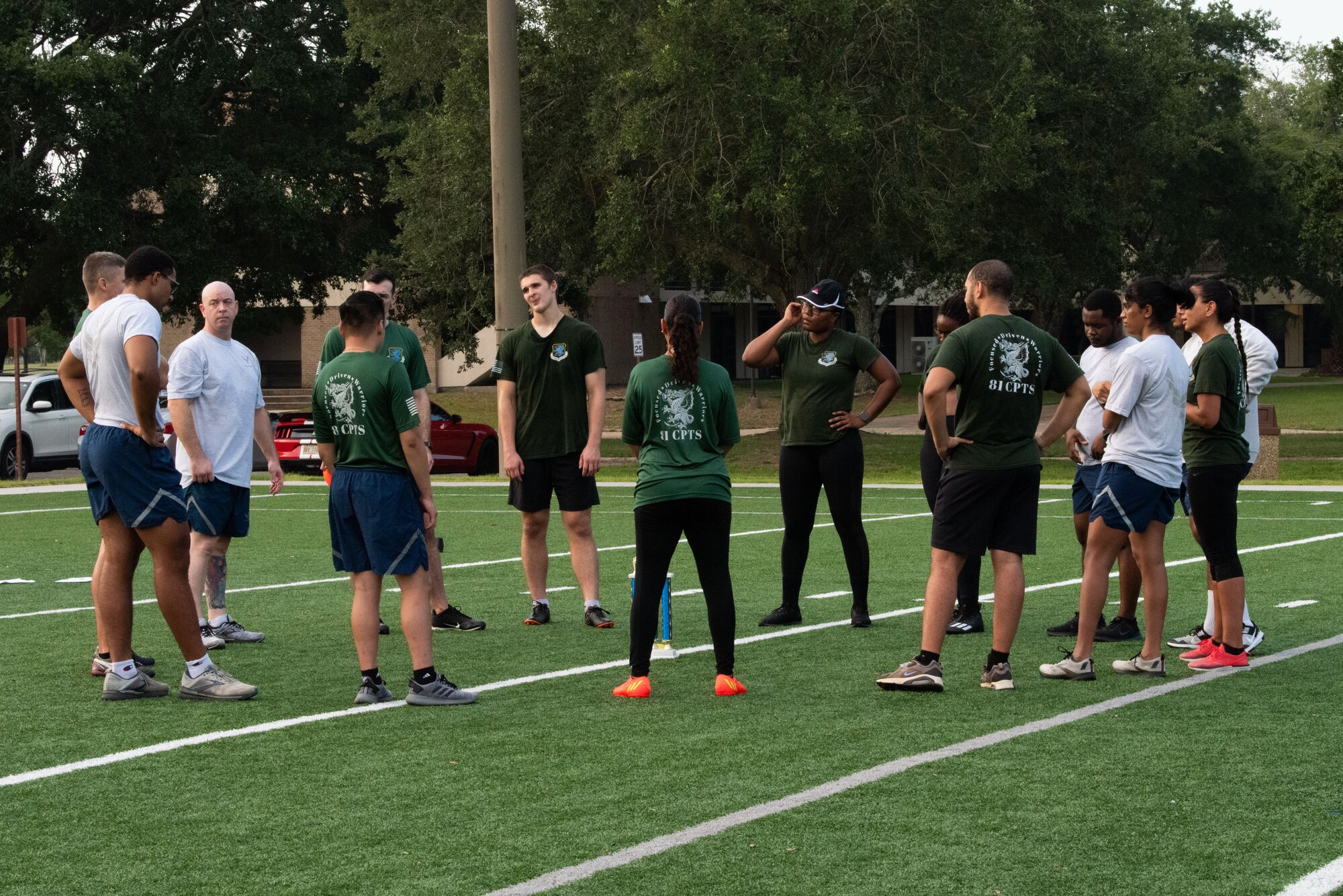 The members of the 81st Comptroller Squadron talk about the exercises and their performance on the Multi-Purpose Turf Field at Keesler Air Force Base, Mississippi, July 28, 2023.