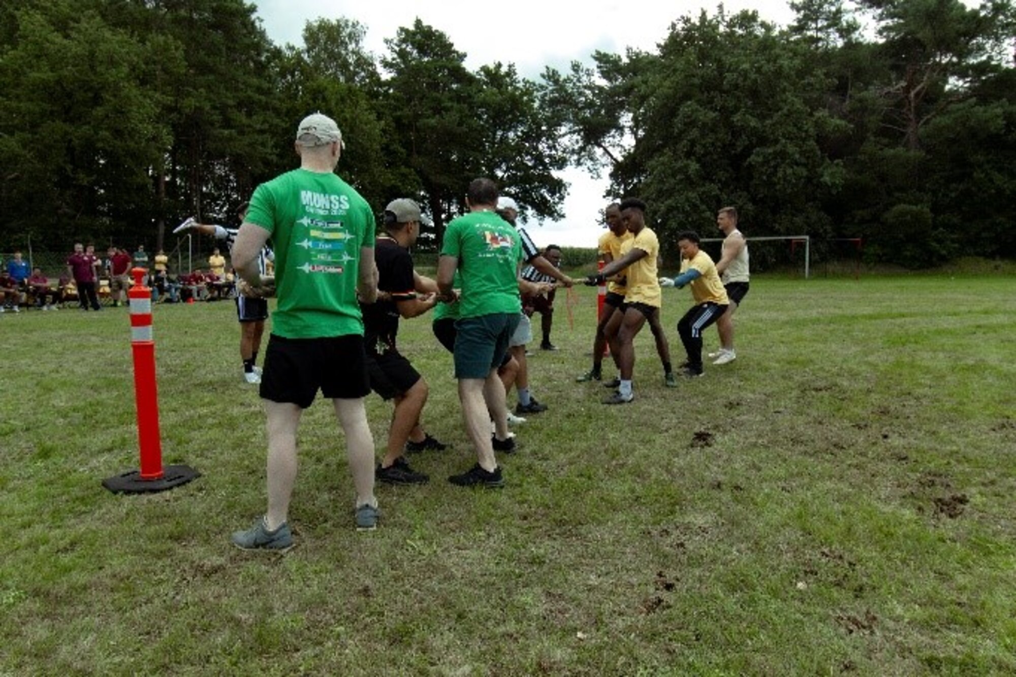 The 702nd Munitions Support Squadron (MUNSS) from Buchel Air Base, Germany, and the 704th MUNSS from Ghedi AB, Italy, compete in tug-of-war during the 2023 MUNSS Olympics at Kleine Brogel Air Base, Belgium, Aug. 4, 2023. The annual event challenges today’s warfighters physically and mentally through a series of sporting and trivia competitions. (U.S Air Force photo by Senior Airman Justice Thomas)