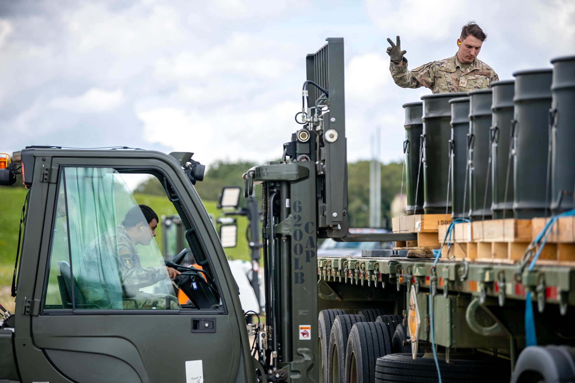 Airmen from the 420th Munitions Squadron utilize a forklift to transport munitions components at RAF Welford, England, Aug. 7, 2023. The 420th MUNS conducted operations in support of a week-long Combat Ammunition Production Exercise, which helped strengthen their combat planning and production concepts. (U.S. Air Force photo by Staff Sgt. Eugene Oliver)