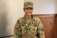 Spc. June Marie Santiago, a native of Brooklyn, New York, serves as a culinary specialist with Headquarters and Headquarters Company, 213th Regional Support Group, Pennsylvania Army National Guard. Santiago states that her unit's mission is important despite the difficulties she sometimes faces as a cook. (U.S. Army National Guard photo by Spc. Annie M. Riley)
