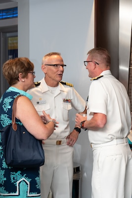 Vice Admiral Johnny Wolfe Jr., director of U.S. Navy Strategic Systems Programs (SSP) (right) visits with U.S. Navy Band Commanding Officr Capt. Kenneth Collins (middle) and Collins's wife (left) during a reception for the SSP workforce and other attendees at the Navy Memorial in Washington, D.C. Vice Adm. Wolfe hosted the Concert on The Avenue, played by the U.S. Navy Band, which featured the storyline and history of the Navy set to the tune of patriotic music (U.S. Navy Photo by Lt. Jennifer Bowman) hosted the Concert on The Avenue, played by the U.S. Navy Band, which featured the storyline and history of the Navy set to the tune of patriotic music (U.S. Navy Photo by Lt. Jennifer Bowman)