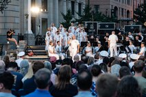 The U.S. Navy Band plays its Concert on the Avenue (COTA) at the Navy Memorial in Washington, D.C. Vice Admiral Johnny Wolfe Jr., director of U.S. Navy Strategic Systems Programs (SSP) hosted the concert, played by the Navy Band for the public, which featured the storyline and history of the Navy set to the tune of patriotic music (U.S. Navy Photo by Lt. Jennifer Bowman)