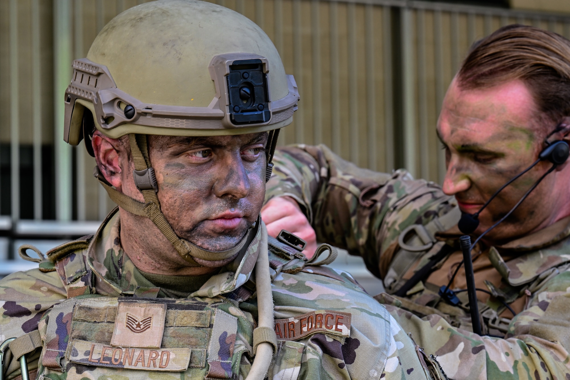 Tech. Sgt. Matthew Turner, a Defender assigned to the North Carolina Air National Guard’s 145th Security Forces Squadron, tightens tactical equipment on Tech. Sgt. John Leonard, a Defender assigned to the 145th SFS, prior to an Integrated Defense Leadership Course training exercise on July 27, 2023, at Camp James A. Garfield Joint Military Training Center, Ohio.