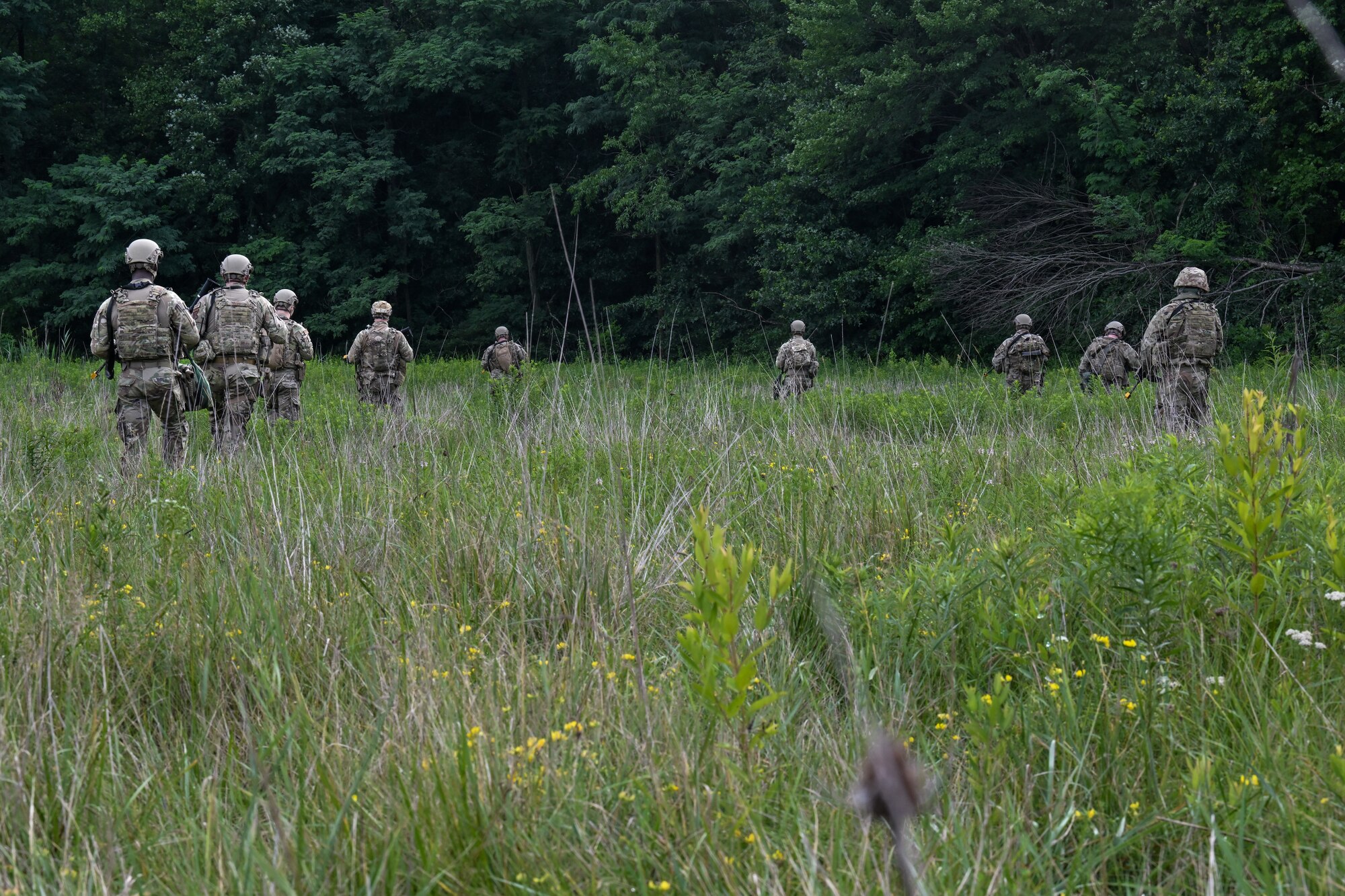 Defenders assigned to the North Carolina Air National Guard's 145th Security Forces Squadron begin navigating their way during an Integrated Defense Leadership Course training exercise on July 27, 2023, at Camp James A. Garfield Joint Military Training Center, Ohio.