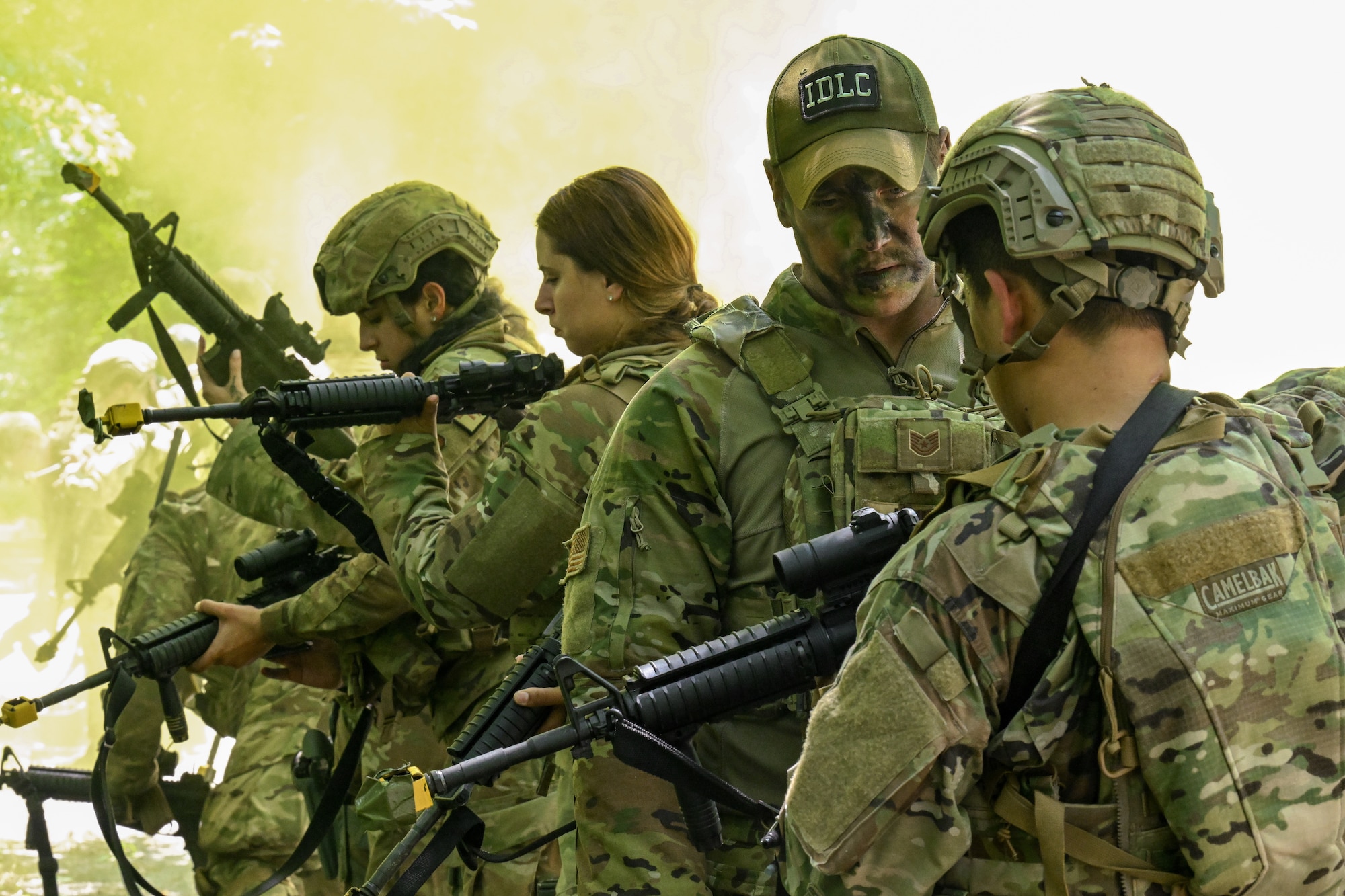 Tech. Sgt. Johnathan Kling, an Integrated Defense Leadership Course cadre member assigned to the 307th Security Forces Squadron, Barksdale Air Force Base, Louisiana, assists IDLC students clear their M4 carbine weapons after an area security operations exercise on July 27, 2023, at Camp James A. Garfield Joint Military Training Center, Ohio.