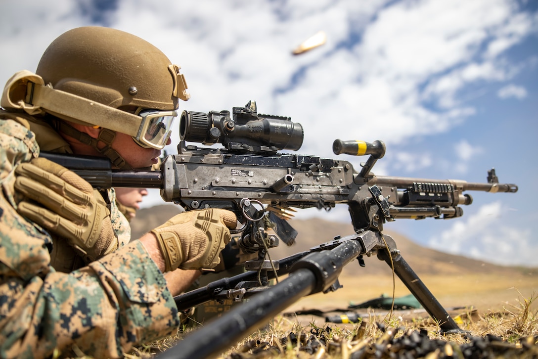 U.S. Marine Corps Cpl. Austin Phelps, a radio operator with 3d Littoral Combat Team, 3d Marine Littoral Regiment, 3d Marine Division, fires an M240B machine gun during a live fire range at Marine Corps Base Hawaii, August 3, 2023. The purpose of this exercise is to sharpen the LCT’s weapons handling skills and increase their readiness for future exercises and operations.