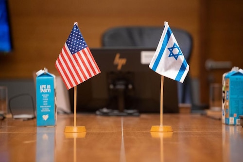 American and Israeli flags adorn a conference table at the Air Senior National Representatives forum in Tel Aviv, Israel, Aug. 3, 2023. Senior Air Force leaders from both countries discussed areas of cooperative opportunities and postured for the future during this year’s iteration. (Courtesy photo)