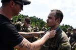 U.S. Army Soldiers from across the nation receive their blue infantry shoulder cords July 26, 2023, in recognition of their completion of the 11B Infantry Transition Course, taught by cadre assigned to the 183rd Regiment, Regional Training Institute, at Fort Barfoot, Virginia.