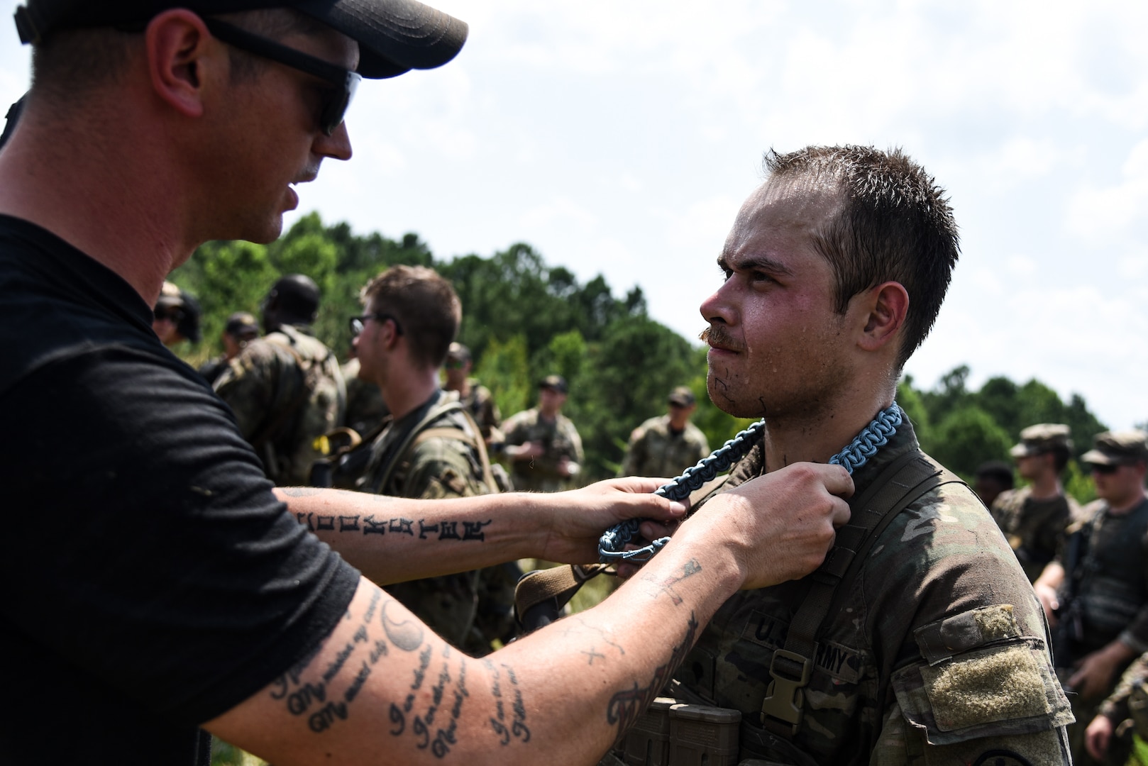 U.S. Army Soldiers from across the nation receive their blue infantry shoulder cords July 26, 2023, in recognition of their completion of the 11B Infantry Transition Course, taught by cadre assigned to the 183rd Regiment, Regional Training Institute, at Fort Barfoot, Virginia.