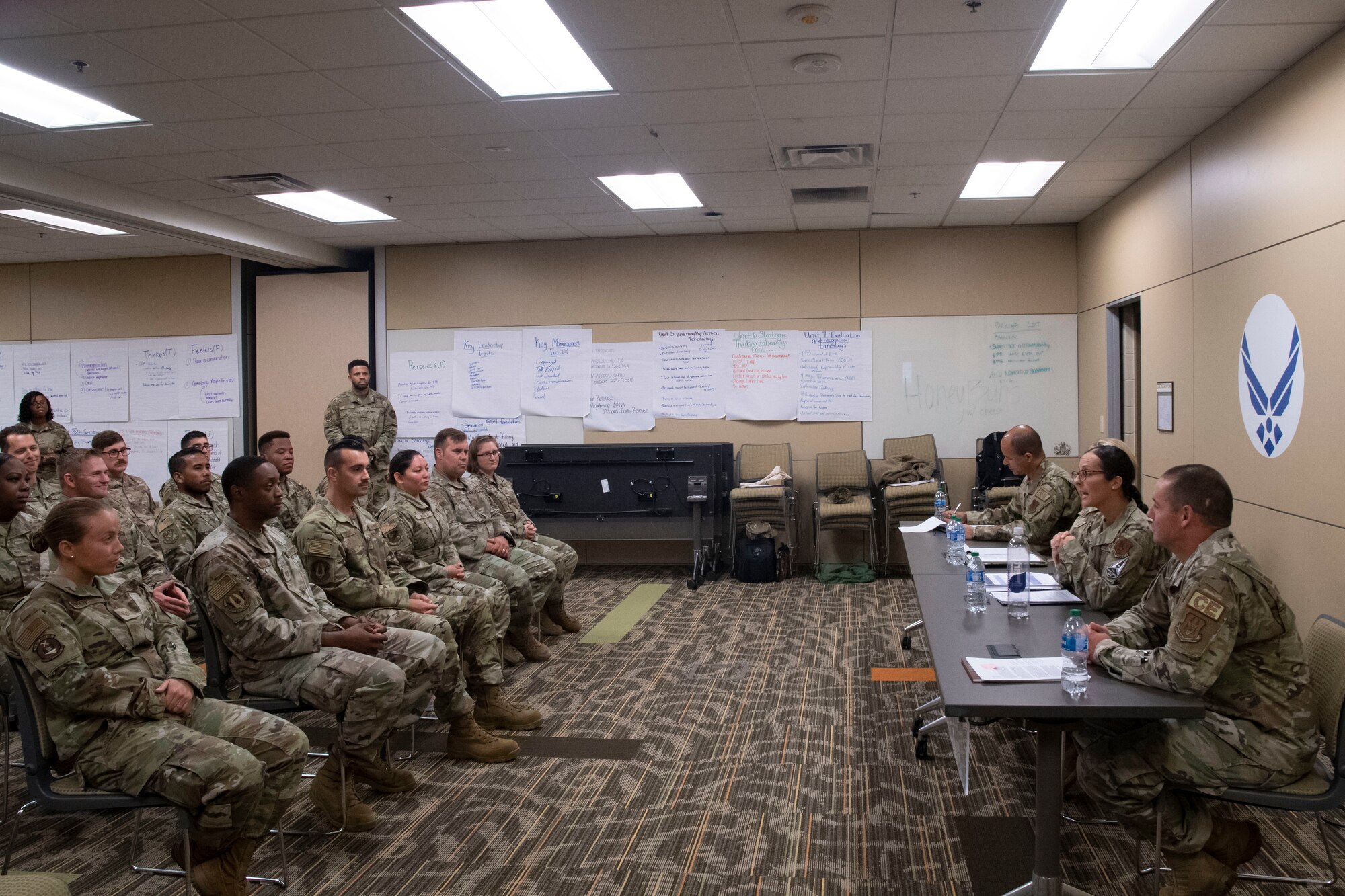 A panel of Chief Master Sergeants speak to a class of students