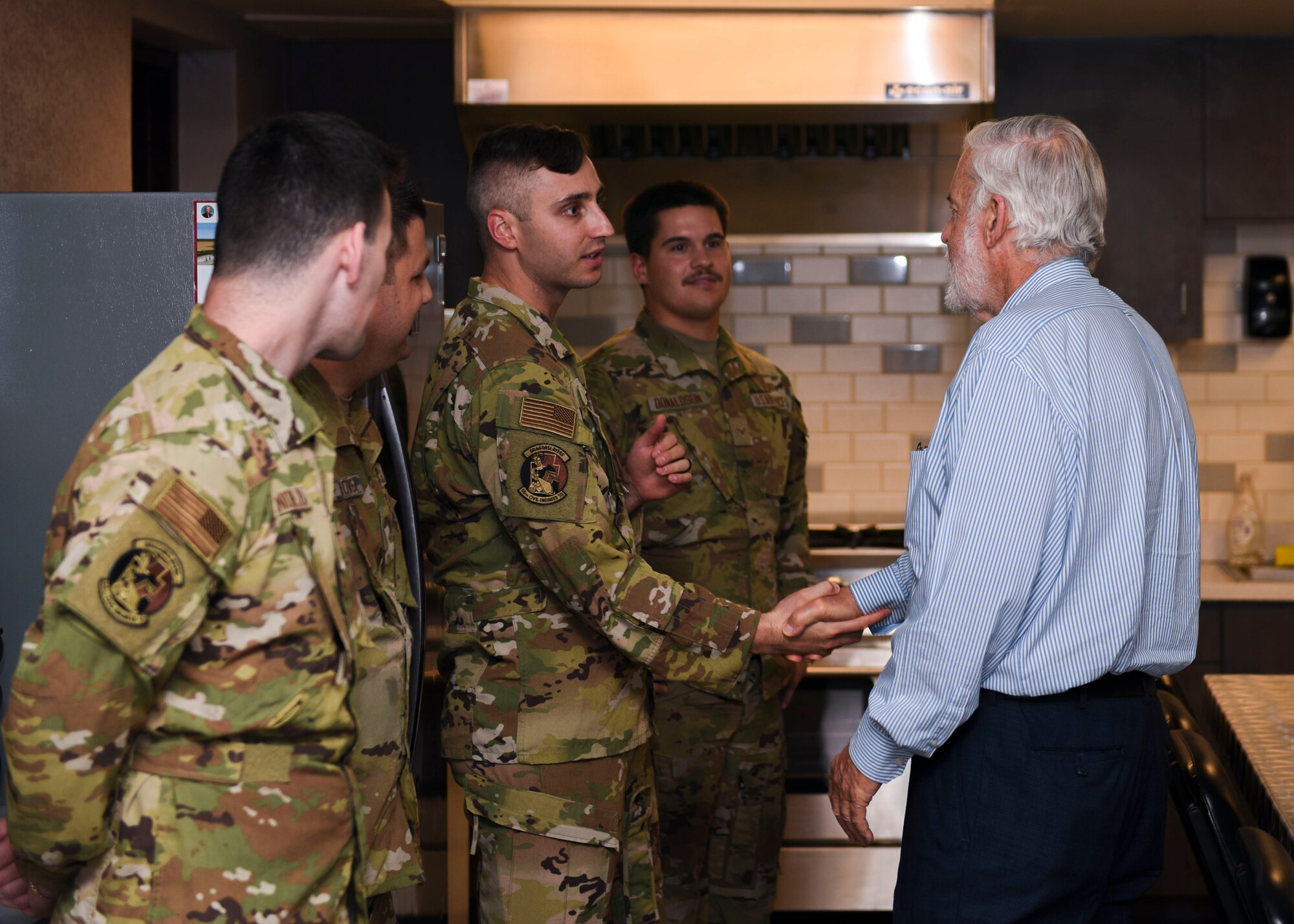 Jerry P. Weiers, Glendale, Arizona mayor, greets 56th Civil Engineer Squadron Airmen during his visit to the Luke Air Force Base Fire Department Aug. 9, 2023, at Luke AFB, Arizona.