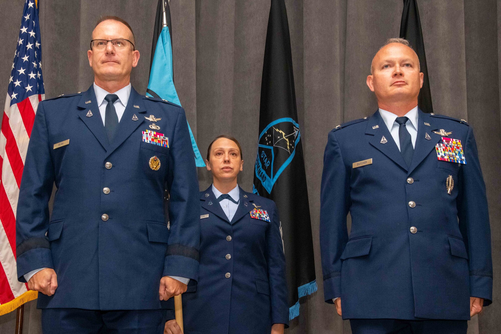 U.S. Space Force Brig. Gen. Timothy Sejba, Commander of Space Training and Readiness Command, left, and U.S. Space Force Col. Bryan Dutcher, Delta 13 commander, right, stand at attention during a change of command ceremony at Maxwell Air Force Base, Ala., Aug. 4, 2023. Delta 13 is the U.S. Space Force's Delta responsible for space education. (U.S. Air Force photo by Sean Ross)