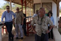 Dan Geltmacher, a range and training area manager with Marine Corps Base and MCBH officials and staff members discusses ongoing renovation and construction of facilities at Pu'uloa Range Training Facility, Hawaii, August 8, 2023. The engagement provided an opportunity for MCBH and local subject matter experts to discuss noise mitigation, environmental protection, and range modernization initiatives.