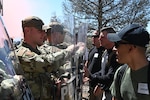 Members of the 220th Military Police Company, Colorado Army National Guard conduct the first joint National Guard response force validation exercise with the 140th and 233rd Security Forces Squadrons, Colorado Air National Guard at Buckley Space Force Base, Aurora, Colorado, Aug. 21, 2022. The joint exercise helped validate and ensure that the Colorado National Guard retains the capability of providing a rapid, all-hazards response force to the State of Colorado. (U.S. Air National Guard photo by 1st Lt. Kathrine Lee)