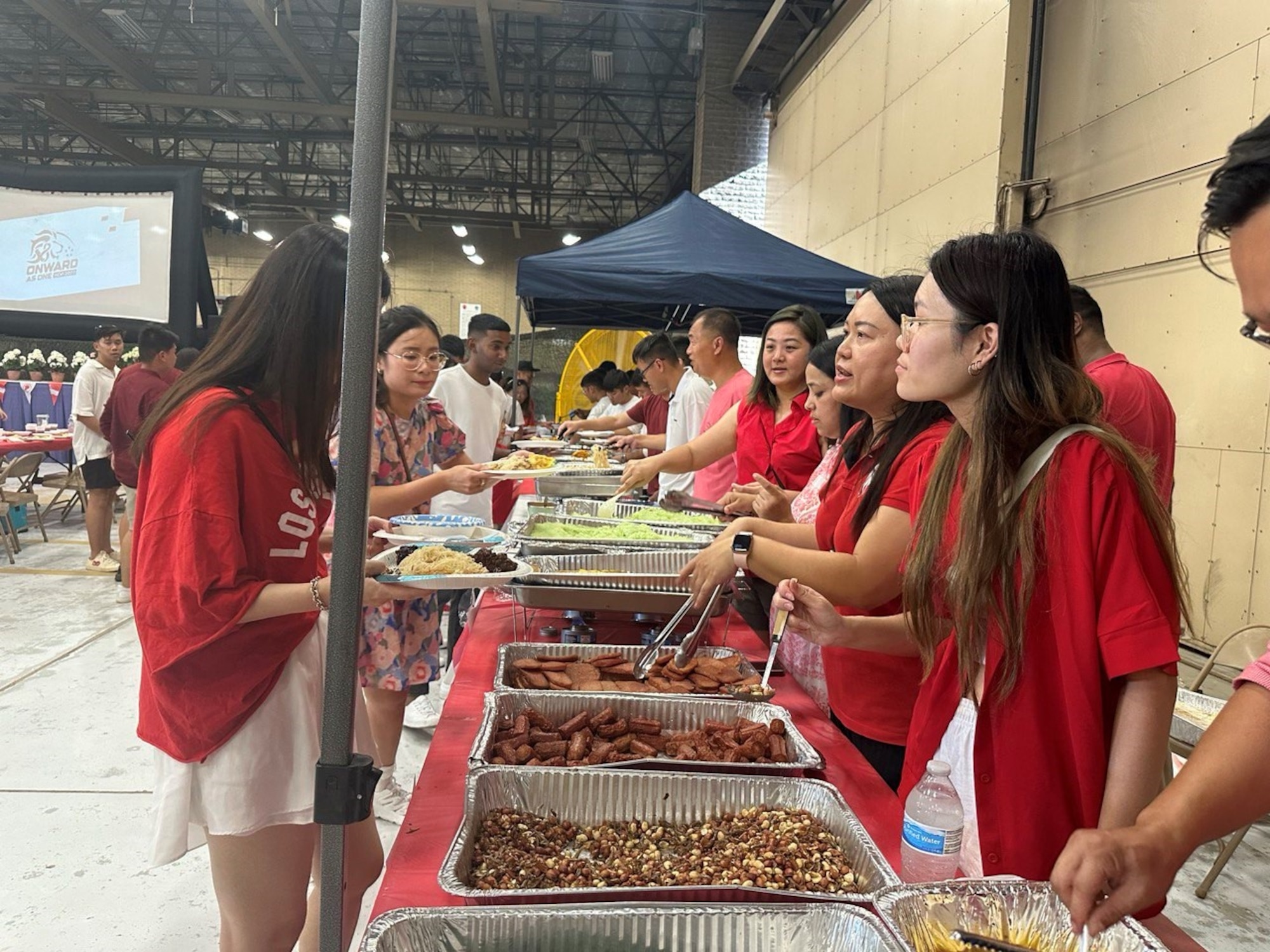 56th Fighter Wing Airmen and leadership celebrate alongside their Republic of Singapore Air Force partners with a potluck at a National Day of Singapore event Aug. 8, 2023, at Luke Air Force Base, Arizona.