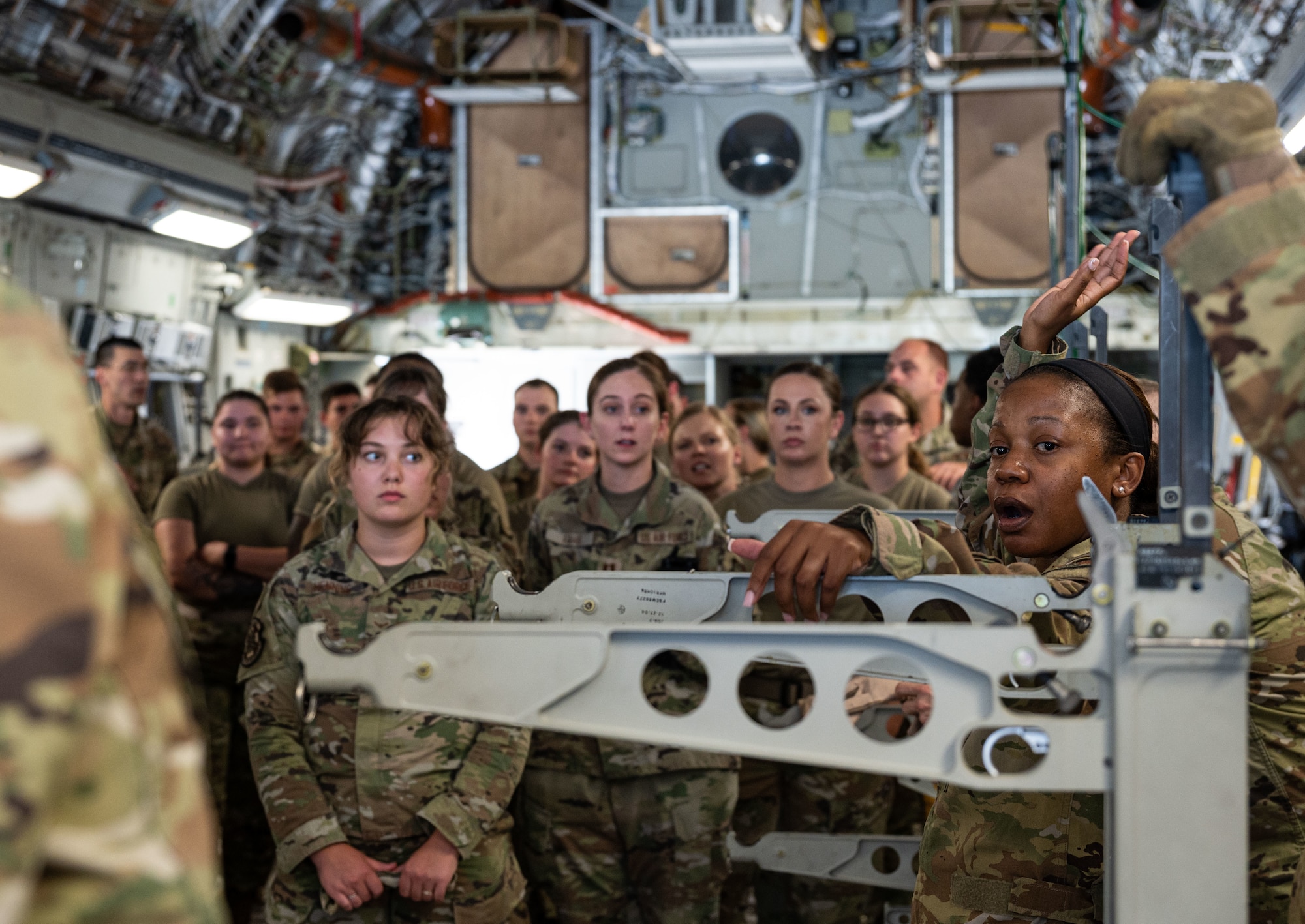 Maj. Kemeshia Greene, right, 142nd Aeromedical Evacuation Squadron chief of aircrew training, Delaware Air National Guard Base, New Castle, Delaware, teaches Team Dover Airmen how to load and unload injured patients from the C-17 Globemaster III at Dover Air Force Base, Delaware, Aug. 9, 2023. MEDIC-X is the Air Force Surgeon General’s Multi-Capable Airmen initiative to ensure all medical personnel, clinical and non-clinical, are equipped with life-sustaining skills needed for future conflicts where resources may be limited. (U.S. Air Force photo by Airman 1st Class Dieondiere Jefferies)