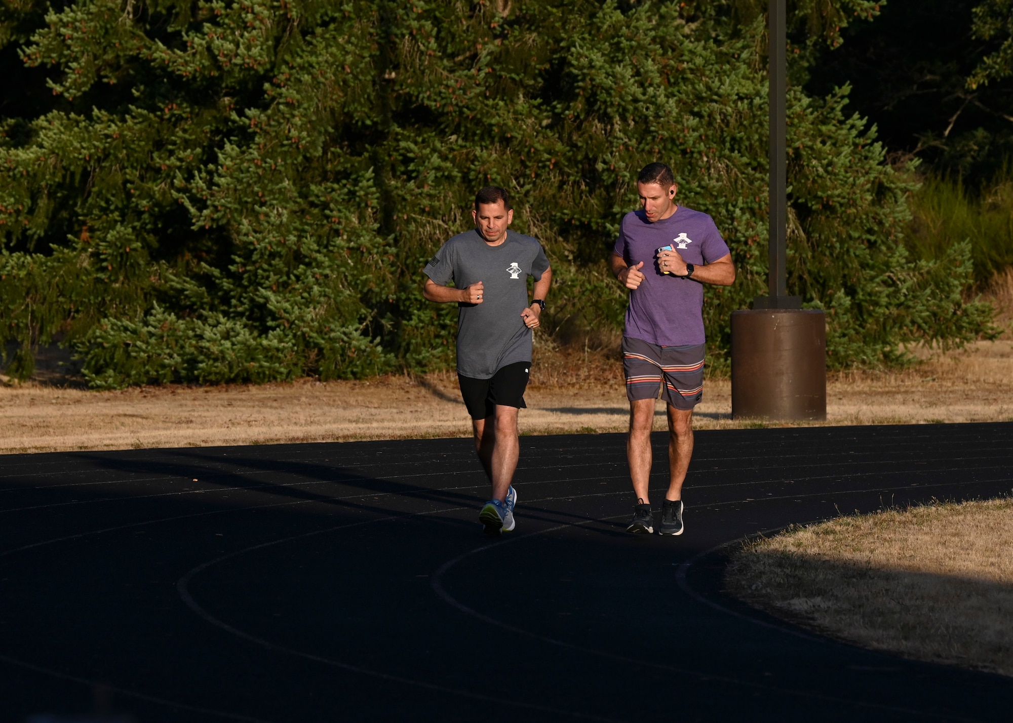 U.S. Air Force Col. Sergio Anaya, left, 62d Airlift Wing commander, and Col. David Morales, 62d AW deputy commander, run during the Dash for Danielle Memorial Run-A-Thon at Joint Base Lewis-McChord, Washington, Aug. 11, 2023. Proceeds from the Dash for Danielle Memorial Run-A-Thon will go to supporting military and community functions throughout the year and a donation will be made in support of domestic violence awareness. (U.S. Air Force photo by Senior Airman Callie Norton)